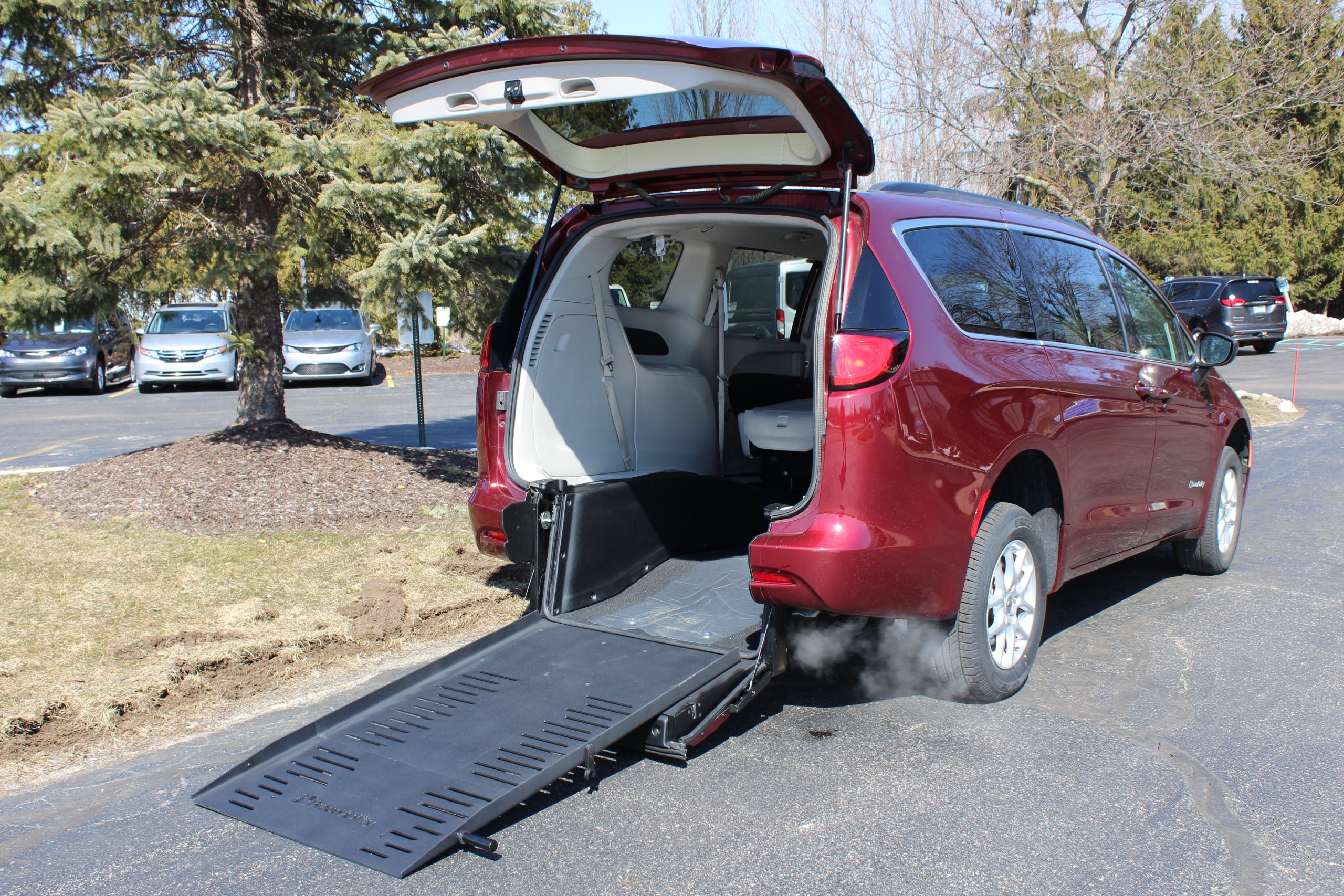 2021 Velvet Red Chrysler Voyager LXI with BraunAbility Rear Entry Conversion