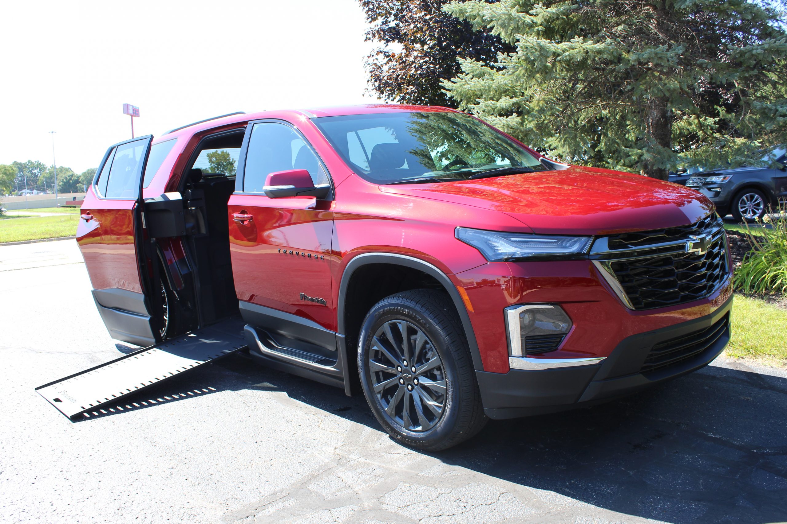 2023 Radiant Red Chevy Traverse 2LT RS with BraunAbility XI Conversion with rubber