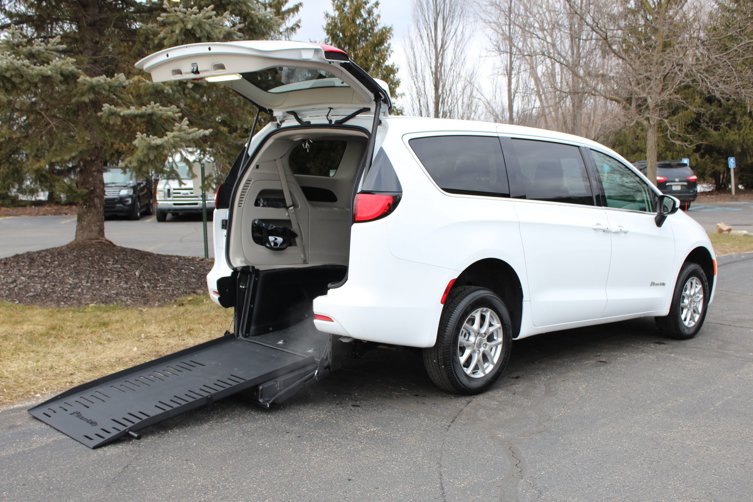 2023 Bright White Chrysler Voyager LX with a BraunAbility V3 Commercial Rear Entry Conversion