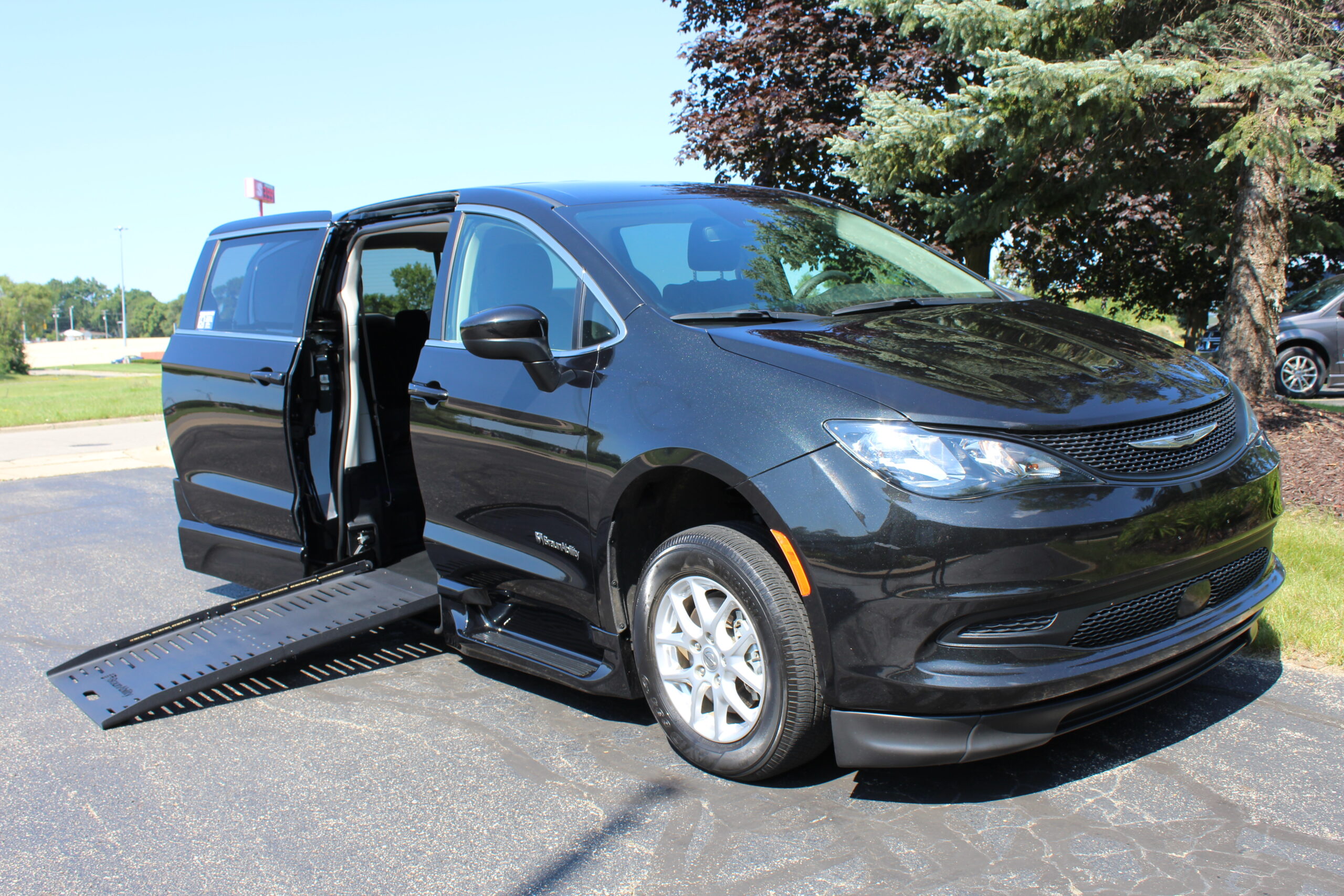 2023 Brilliant Black Chrysler Voyager LX with XT Conversion with Rubber