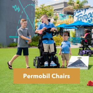 Permobil power wheelchair user outdoors with family
